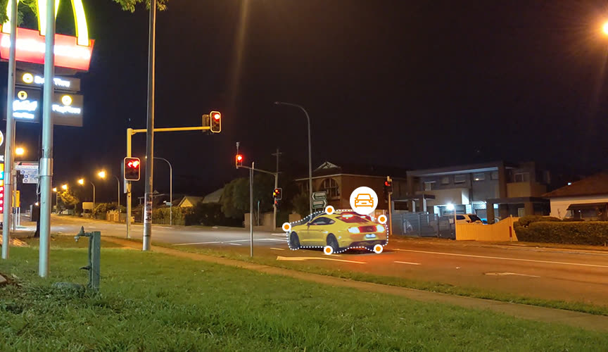 AI vehicle detection highlighting a car on the road at night