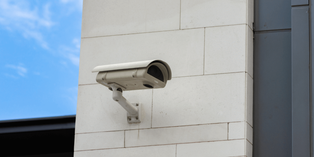 Surveillance camera built into the stone wall of the building