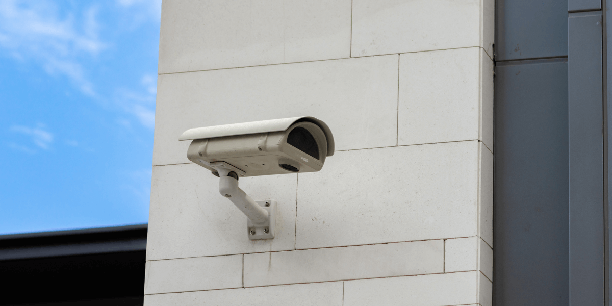 Surveillance camera built into the stone wall of the building