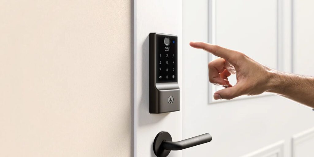 Person reaching to use a smart digital door lock with touchscreen keypad for home security access