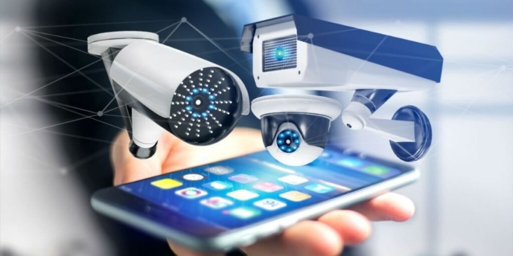 A person holding a smartphone displays three virtual security cameras hovering above the screen.