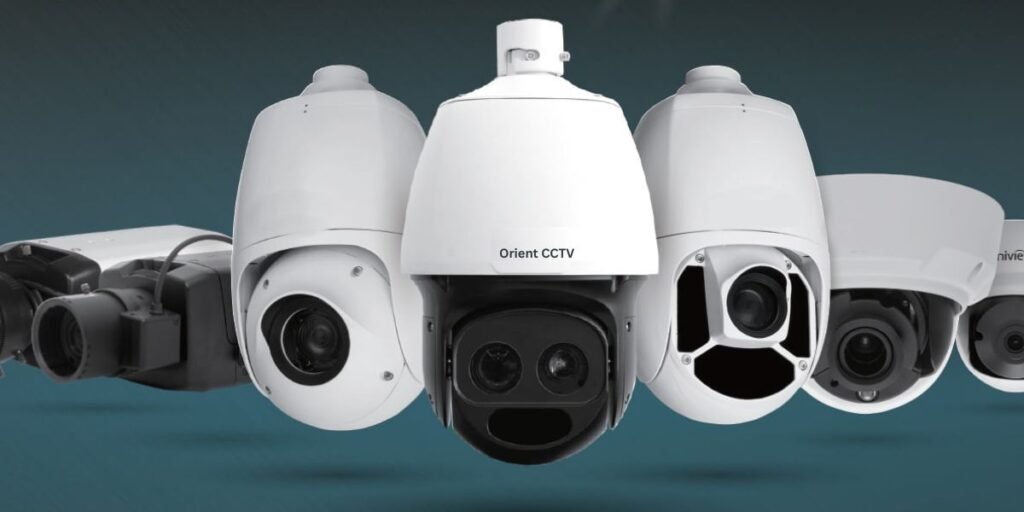 A group of five white and black PTZ dome security cameras** are lined up against a blue background.