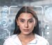 Woman's face centered in a digital HUD with scanning boxes, data graphs, and biometric icons for AI facial recognition.